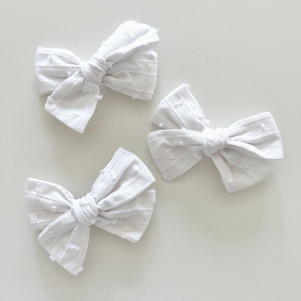 
            
                Load image into Gallery viewer, White Swiss Dot Bow - BohemianBabies
            
        