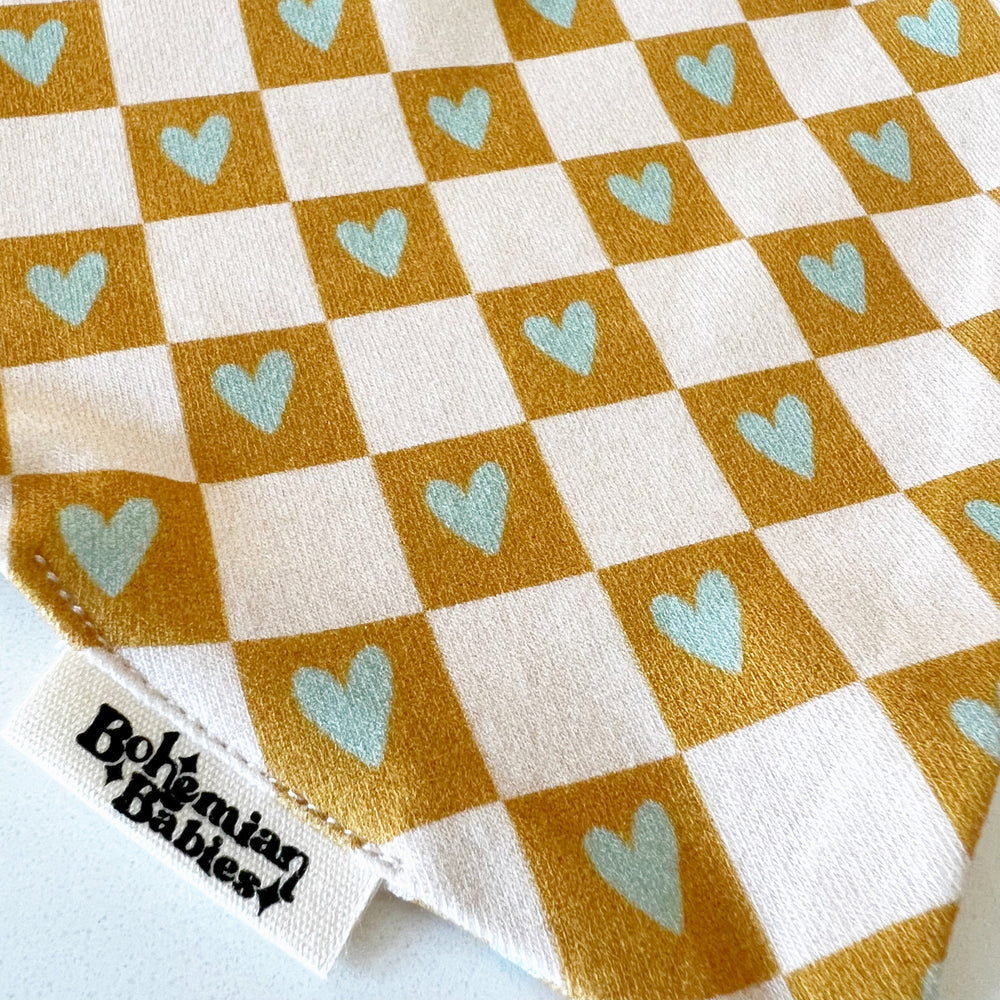 
            
                Load image into Gallery viewer, Checkered Hearts Organic Bandana Bib - BohemianBabies
            
        
