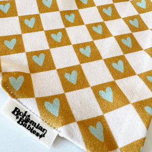 
            
                Load image into Gallery viewer, Checkered Hearts Organic Bandana Bib - BohemianBabies
            
        