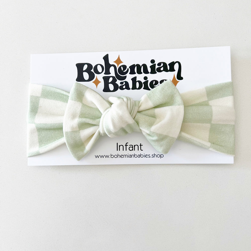 
            
                Load image into Gallery viewer, PREORDER - Dewkist Checkered Organic Bow Headband - BohemianBabies
            
        