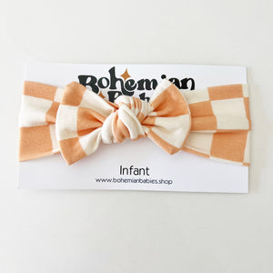 
            
                Load image into Gallery viewer, PREORDER - Rose Pink Checkered Organic Bow Headband - BohemianBabies
            
        