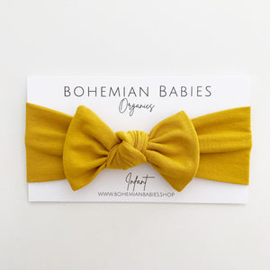 
            
                Load image into Gallery viewer, Golden Bamboo Bow Headband - BohemianBabies
            
        